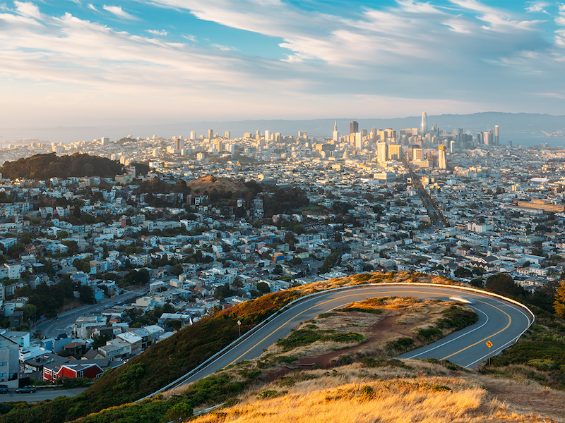 Drone view of Twin Peaks, the ocean, clouds and they city and neighborhoods